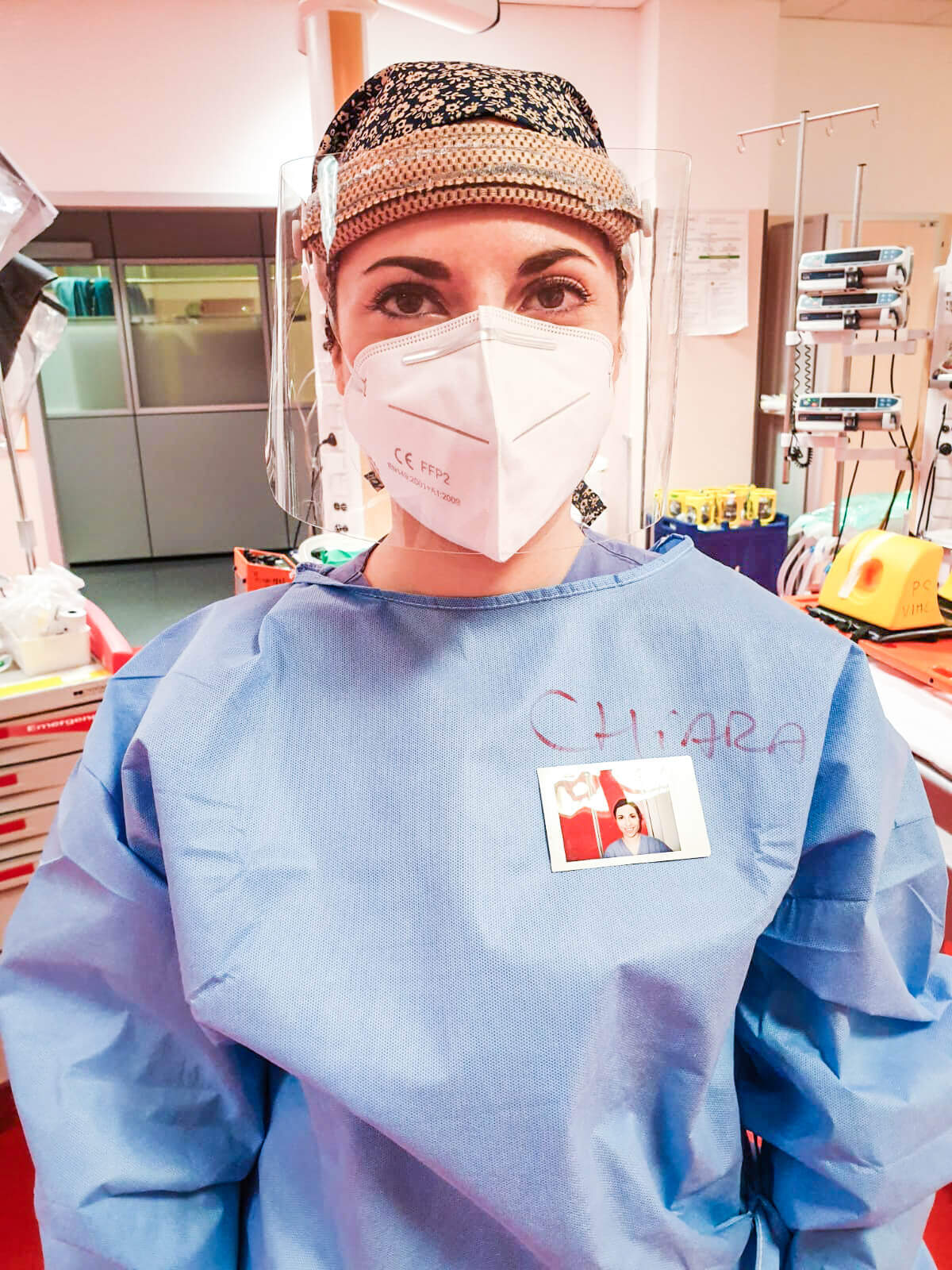 A medical worker wears an Instax portrait