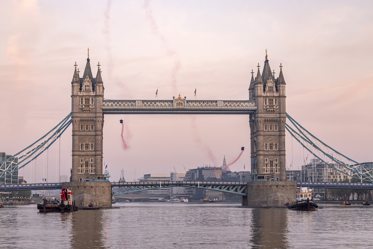 Marco Fuerst and Marco Waltenspiel of Austria fly through Tower Bridge in London, Great Britain on May 12, 2024.