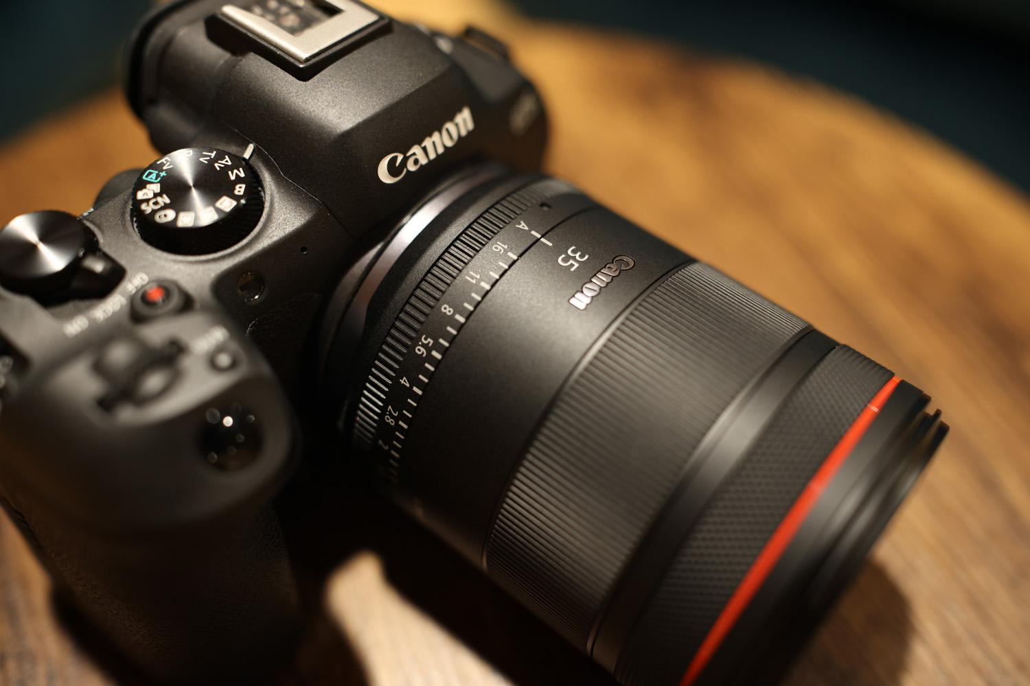 Canon RF35mm f/1.4 L VCM attached to camera on wooden table