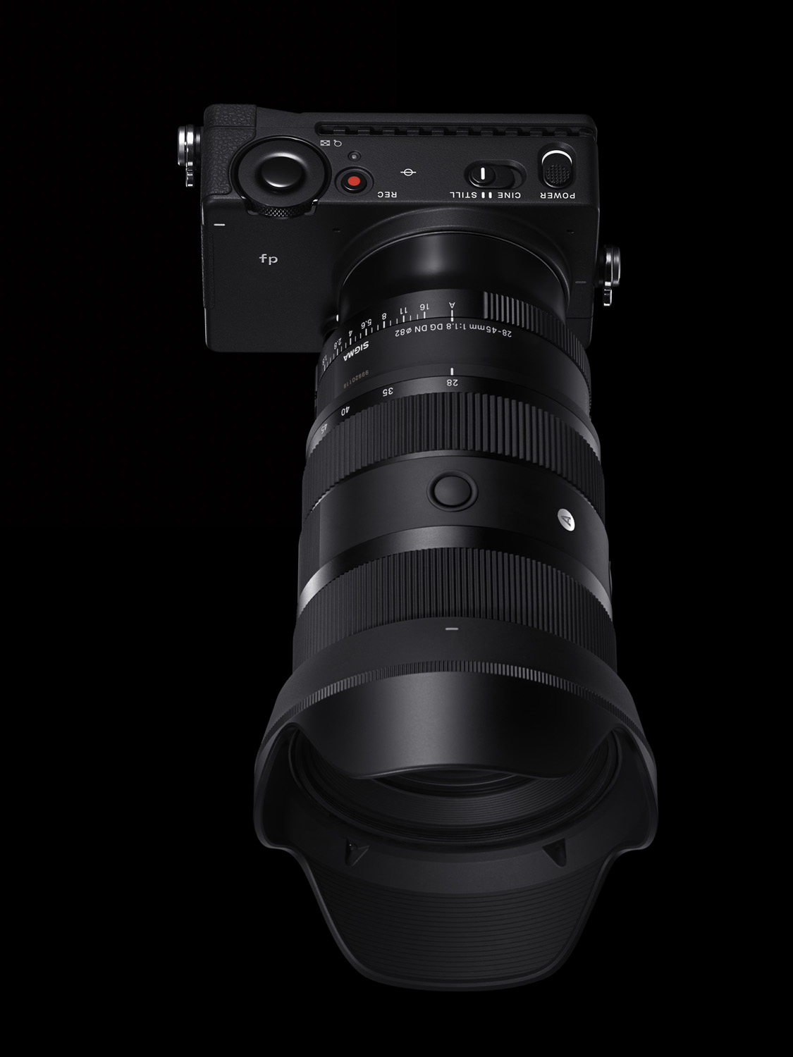 Product photo of the 28-45mm f/1.8 DG DN Art lens attached to camera on black background