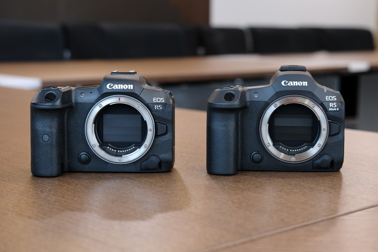 Canon EOS R5 and EOS R5 Mark II side by side in a wooden table