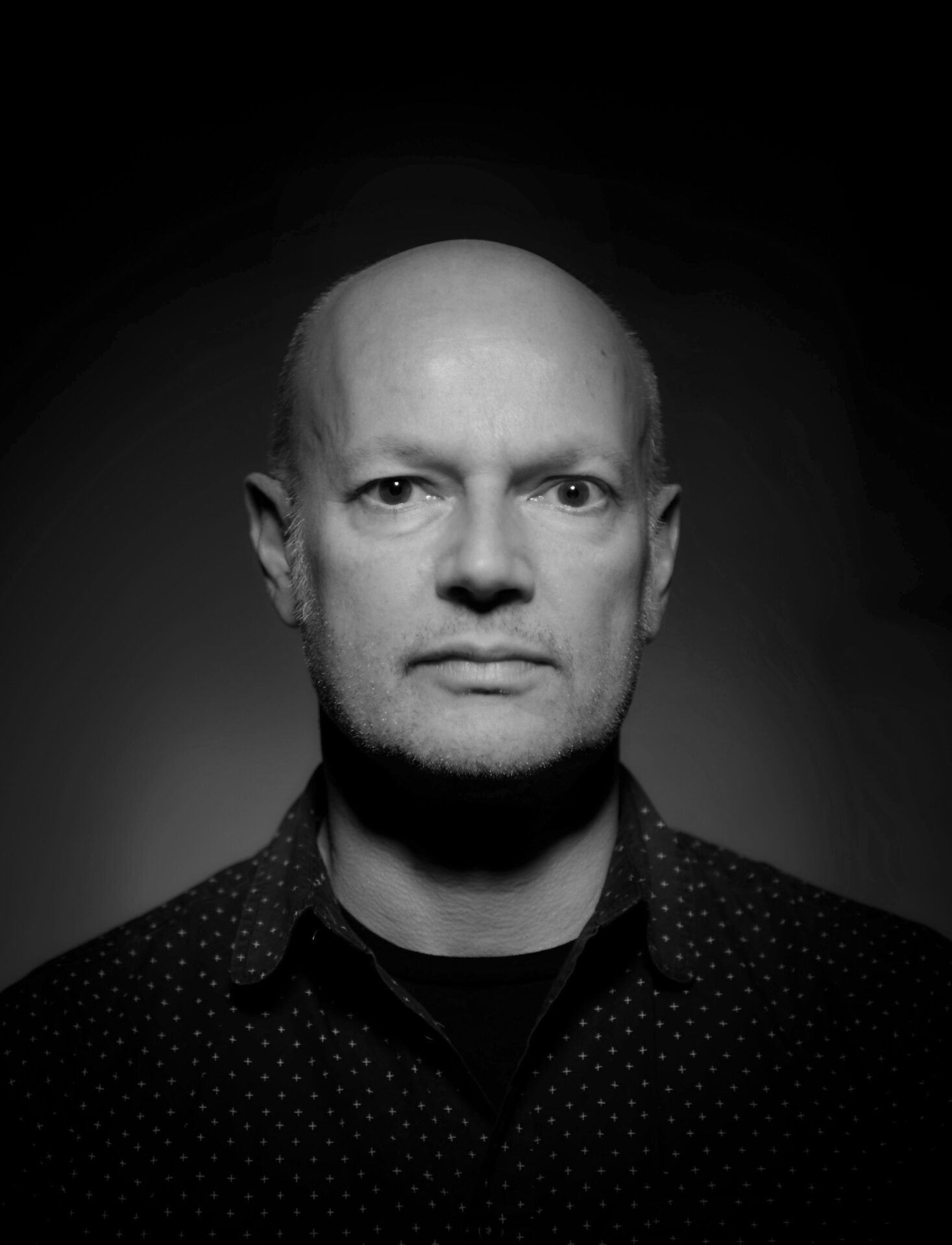 Black and white portrait of photographer Nick Dunmur