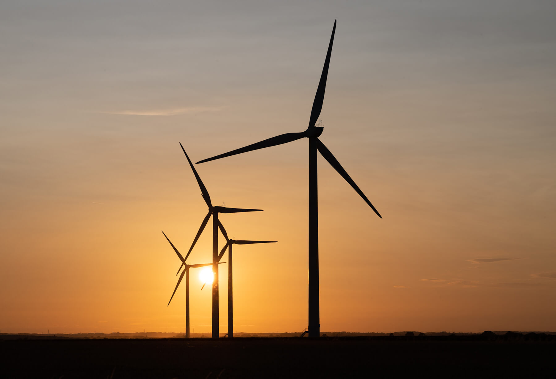 Wind turbines at sunset