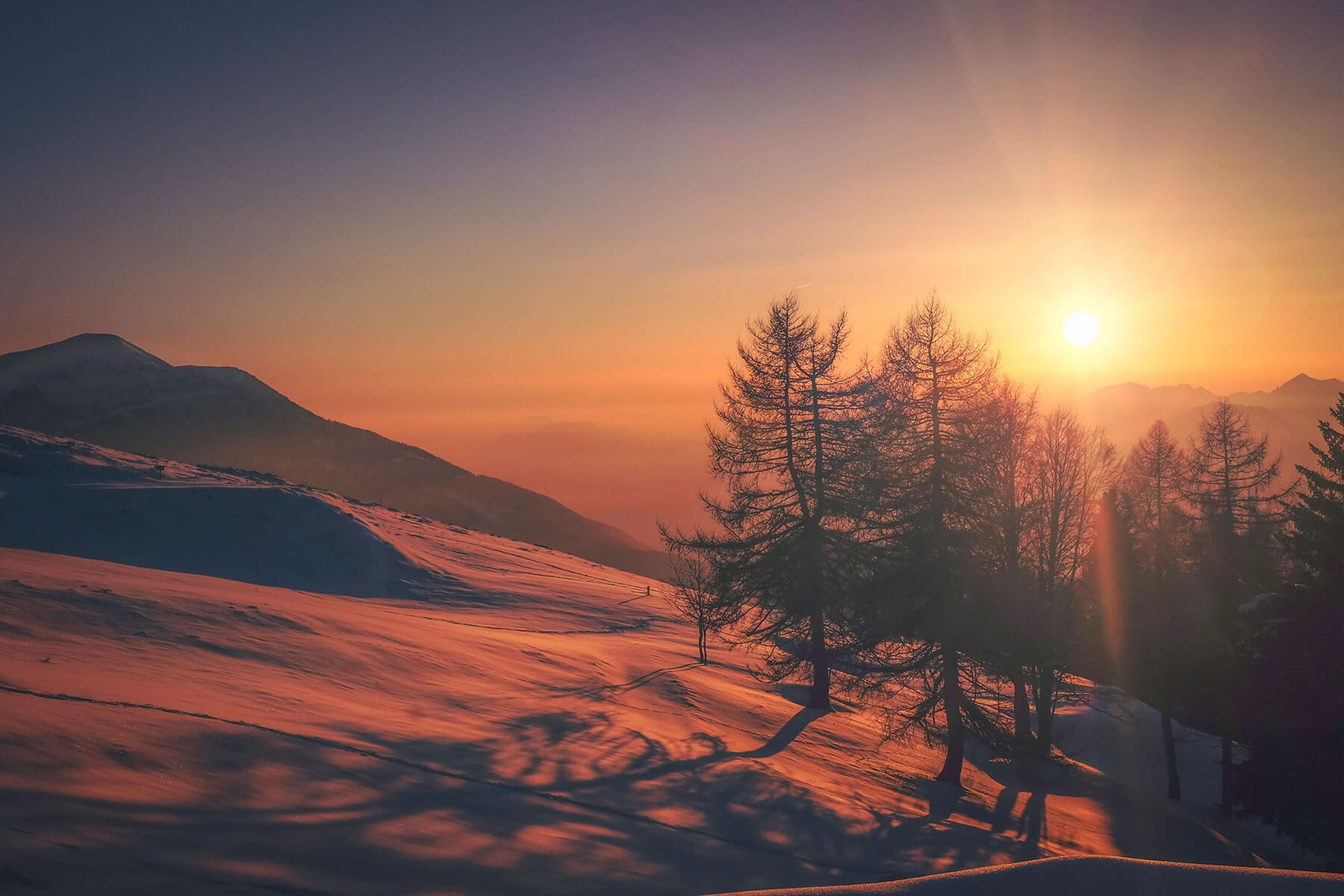 Snowy mountain sunset